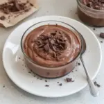 Delicious chocolate protein pudding in a bowl with a spoon