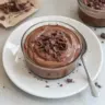 Delicious chocolate protein pudding in a bowl with a spoon