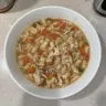 Bowl of Crock Pot Italian Chicken Soup with fresh herbs and vegetables
