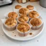 Freshly baked easy Biscoff muffins on a cooling rack.