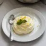 Delicious easy lemon mousse dessert topped with lemon zest