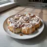 Warm and fluffy easy one hour cinnamon rolls on a baking tray