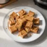 Delicious easy peanut butter fudge on a white plate, ready to enjoy.