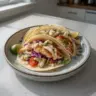 Delicious fish tacos topped with the best taco sauce