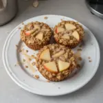 Fluffy baked apple cinnamon oatmeal cups served on a plate