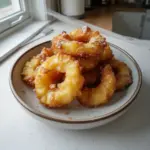 Delicious homemade pineapple fritters served on a plate