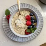 Bowl of high protein oatmeal topped with fruits and nuts for a nutritious breakfast