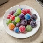 Bowl of colorful Kool-Aid Grapes as a refreshing snack treat