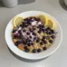 Delicious plate of Lemon Blueberry Baked Oats topped with fresh berries