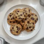 Levain-style two-chip chocolate chip cookies on a baking sheet
