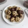 Delicious no-bake cookie dough bites coated with chocolate chips