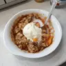 Delicious Peach Crisp for Two served in a bowl with a crunchy topping