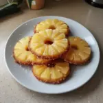 Pineapple upside down sugar cookies on a baking tray