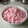 Quick Strawberry Shortcake Puppy Chow recipe with strawberries and chocolate.