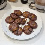 Delicious salted caramel chocolate cookies on a plate.