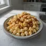 Delicious sweet caramel corn in a bowl, perfect for a tasty snack.