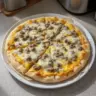 Biscuits and Sausage Gravy Breakfast Pizza topped with savory ingredients
