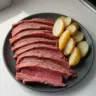 Delicious corned venison served on a rustic plate with herbs and spices