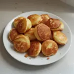 Delicious and fluffy breakfast pancake poppers served with syrup
