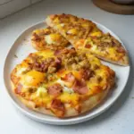 Delicious Breakfast Pizza with eggs, cheese, and fresh toppings