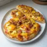 Delicious Breakfast Pizza with eggs, cheese, and fresh toppings