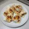 Cheesy bacon ranch wraps served on a plate with fresh ingredients