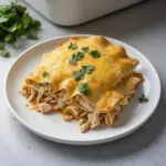 Delicious cheesy baked chicken enchilada casserole served in a dish