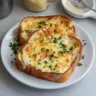 Cheesy Texas Toast topped with melted mozzarella and garlic butter