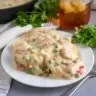 Delicious Chicken a la King with creamy sauce and vegetables over rice.