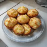 Delicious Coconut and Pineapple Cottage Cheese Muffins on a plate