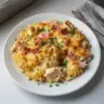 Delicious Crazy Good Chicken Pasta Casserole garnished with fresh herbs