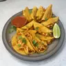 Delicious easy baked crispy chicken tacos plated with toppings