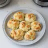 Freshly baked easy drop biscuits on a cooling rack