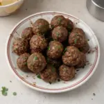 Delicious easy venison meatballs served on a plate with sauce