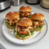 Delicious honey mustard chicken sliders served with fresh toppings