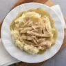 Delicious homemade rotisserie chicken gravy poured over succulent chicken.