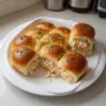 Juicy chicken sliders made with rotisserie chicken served on a plate
