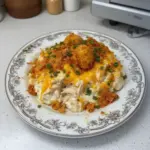 Delicious Million Dollar Chicken Casserole topped with cheese and breadcrumbs