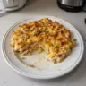 Baked Neiman Marcus Chicken Casserole topped with golden cheese and breadcrumbs