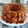 Delicious ooey gooey monkey bread served warm with a caramel glaze.