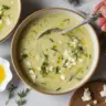 Creamy roasted zucchini feta soup topped with fresh herbs and feta cheese.