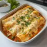 Delicious homemade Rotisserie Chicken Enchiladas topped with cheese