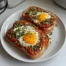 Delicious Shakshouka Toast topped with eggs and fresh herbs