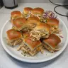 Shredded chicken sliders on a plate, perfect game day snack
