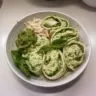 Simple 3-ingredient pesto chicken salad with vibrant colors and fresh ingredients.