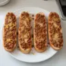 Delicious Sloppy Joe filling on French bread slices, ready to enjoy.