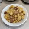 A delicious slow cooker sausage and potato casserole dish ready to serve
