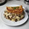 A delectable Swiss Mushroom Melt sandwich with melted cheese and sautéed mushrooms