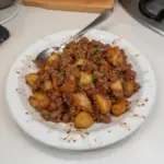 Plate of tasty ground venison hash with vegetables and spices