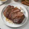 Tender rump roast recipe with garlic and herbs on a serving plate